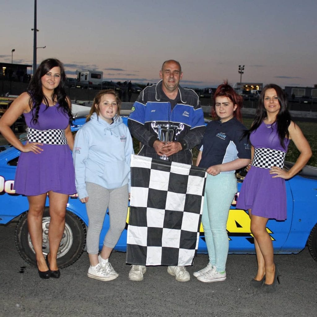 Winner of the Lightning Rods final at Tullyroan Oval on Saturday night is presentined with the trophy by Shannon Ward and Kiera McConnell representing ASC Cars