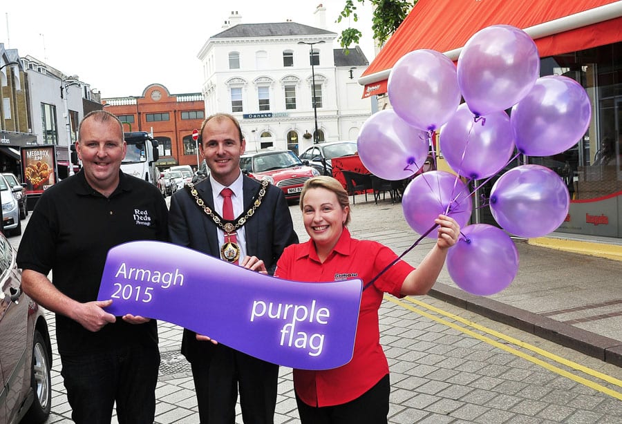 Celebrating the city’s latest success with Lord Mayor, Armagh City, Banbridge and Craigvon Borough Council, Darryn Causby, is Malachy O’Neill, Chair of Armagh City Centre Management and Teresa McGee, Manager of Rumour Espresso Bar.