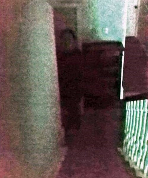 The outline of a man appears at the bottom of these stairs at a house in Armagh. According to the photographer, no one was there