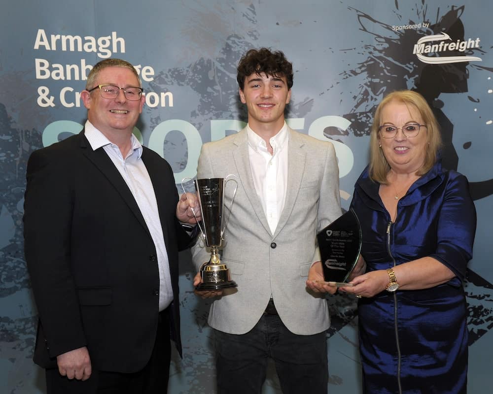 Charlie Rowe from Banbridge Academy and Banbridge Hockey Club wins the Youth Male Award sponsored by Total Hockey. Alan McMurray from Total Hockey and Edith Jamison from Armagh, Banbridge and Craigavon Sports Forum present the award.