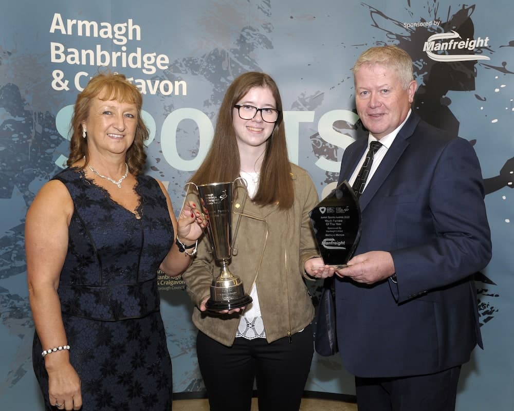 Kathryn Morton from Ballyvally Archers, Banbridge wins the Youth Female Award sponsored by Manfreight Limited. Irene Campbell from Manfreight Limited and Cathal O’Neill Chair of by Armagh, Banbridge and Craigavon Sports Forum present the award.