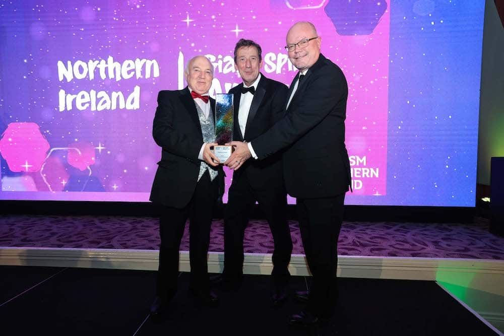 Michael Morris and Terry Cross, Hinch Distillery winner of Tourism NI’s Best Tourism experience (large) award, presented by Shane Clark, Tourism Ireland