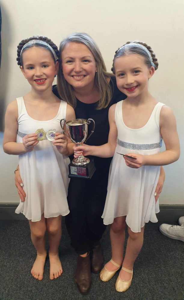 Sonia with Brooke McConkey and Lucia Greene plus some silverware at a past Ballymena Festival!