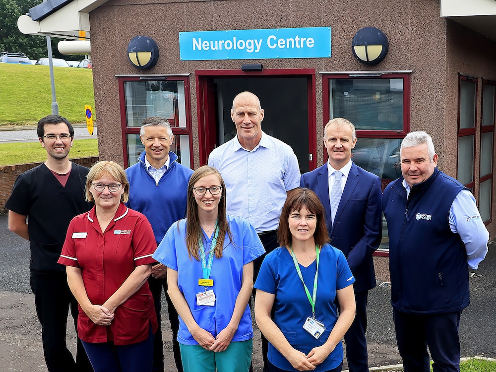Stuart Thom, Mark Bailey and Paddy Johns, fundraisers from the My Name'5 Doddie Foundation have visited the Neurology Centre in Craigavon Area Hospital to see how their funding is being used to help people across NI with Motor Neuron Disease (MND)