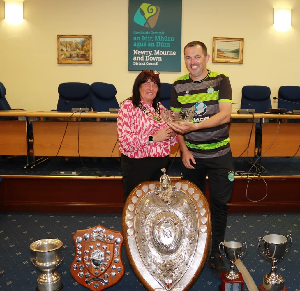 Cllr Councillor Valerie Harte presents JohnHogg, Manager, Cleary Celtic with an inscribed crystal bowl to recognise the outstanding achievements of their 1st team winning five trophies in one season.