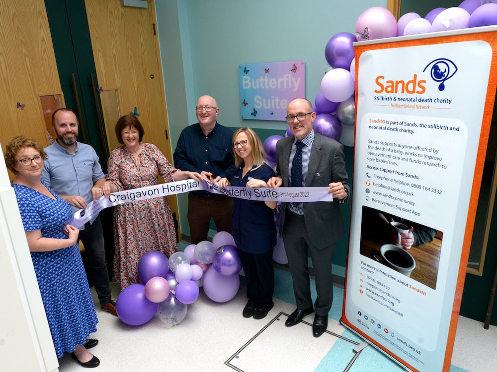 Pictured at the official opening of Craigavon Area Hospital’s Bereavement Suite –‘ The Butterfly Suite’ is Sands representatives, Marc Harder (Head of Bereavement Care), Stephen Guy and Andrew with Mary Dawson (Lead Midwife at Craigavon Area Hospital), Caroline Keown (Assistant Director of Integrated Maternity and Women’s Health) and Dr Beverly Adams (Divisional Medical Director of Integrated Maternity and Women’s Health).