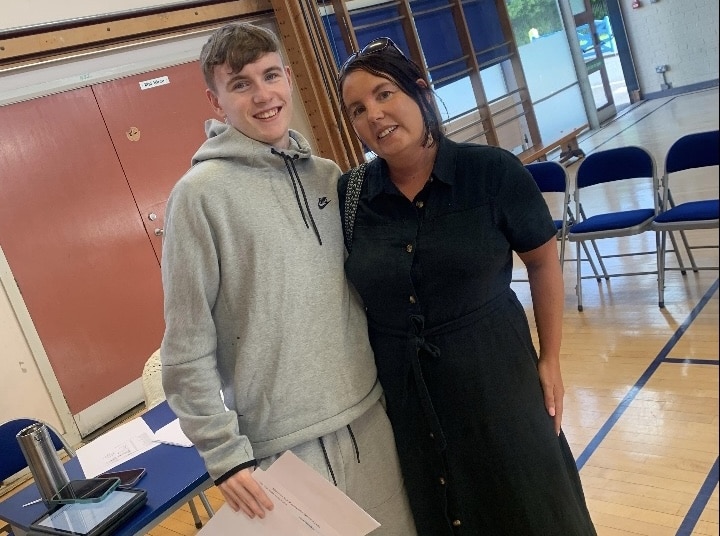 Joel and his mum collecting his GCSE results.
