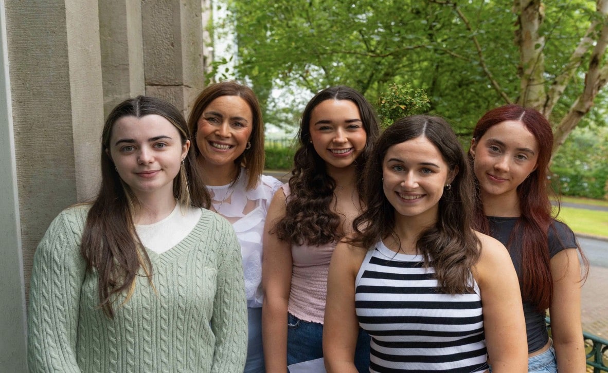 Seeing Stars. Chloe Lenagh, Eimear Lennon, Beth McConnell and Katie McQuade celebrate with Head of Sixth Form, Mrs Monique Rennie. Each of these girls achieved an impressive three A* grades.