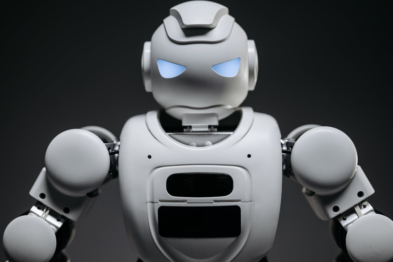 Close Up Shot of White Robot Toy