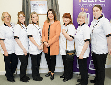 Mairead Mackle, centre, with members of the Homecare Independent Living care staff