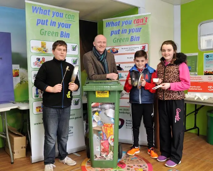 David Philips, Recycling Inspector with David Macdonald, Michael McStravick and Eve McStravick in the 'Swamp Bus' recycling centre.