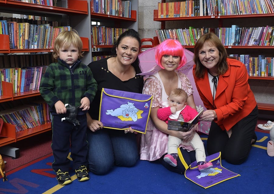 Pictured in photo at Armagh Library (L-R): Josh Oates (aged2) Natasha Sayee (SONI) Polly Pocket with Myia Wilson (6 months) & Liz Canning (Book Trust)