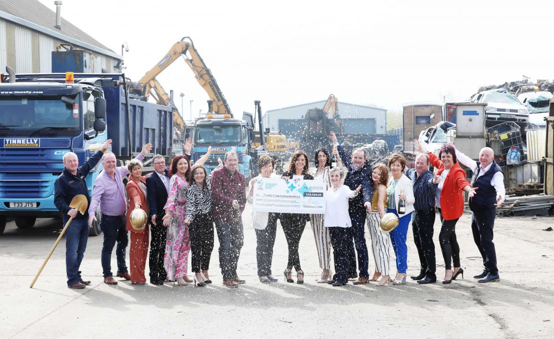 Michelle OHare, Gareth Tinnelly and members of the Tinnelly Group Lottery Syndicate celebrate their £253,489.30 EuroMillions win at the demolition companys headquarters in Newry.