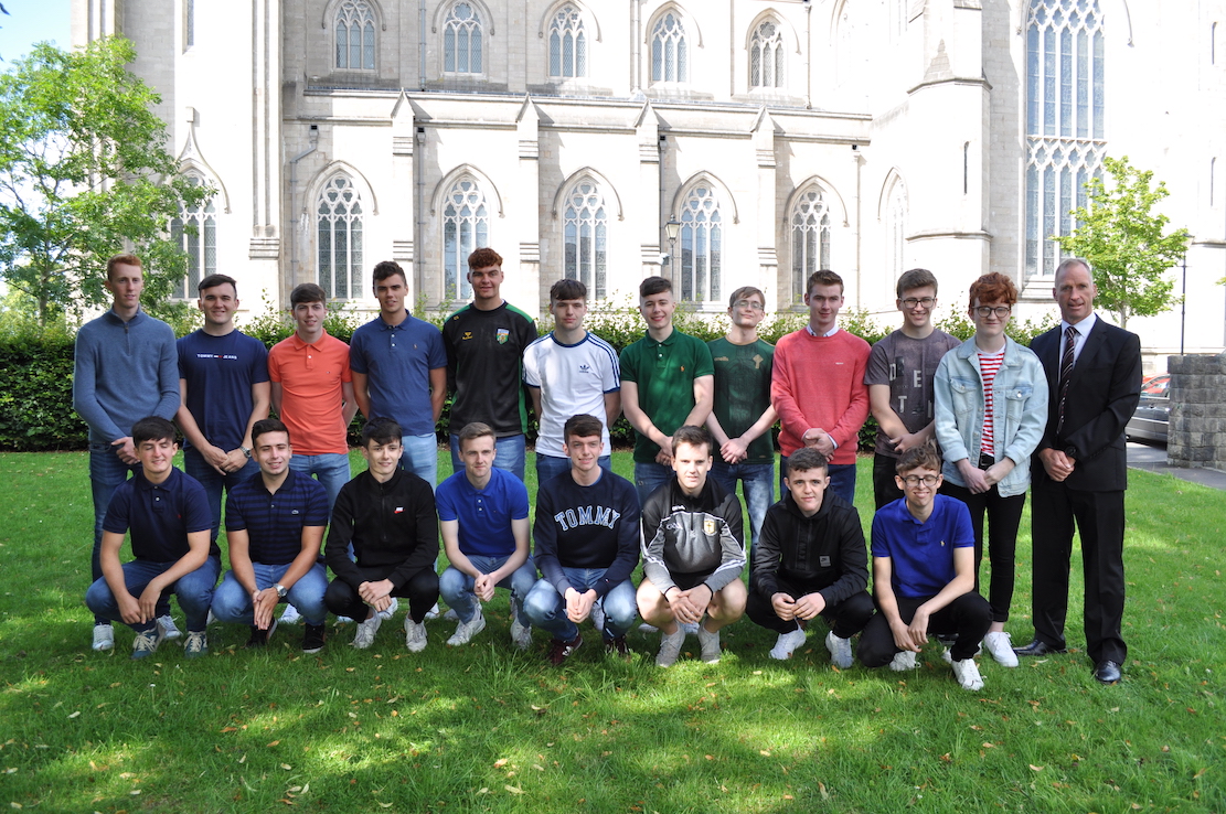 Delighted Year 14 students from St Patrick’s Grammar School who achieved outstanding grades at A level! Pictured are the group of 19 students who each gained 2 or 3 A/A* grades. The successful students are pictured with Mr Dominic Clarke, School Principal