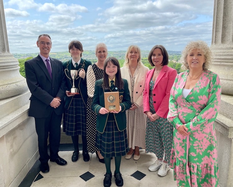 Pupils and staff from St Catherine's College, Armagh being presented with the Derrytrasna pastoral care award by the Permanent Secretary of the Department of Education, Dr Mark Browne and Director of Public Health, Public Health Agency Dr Joanne McClean