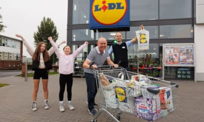 Lurgan Store Manager Simon Magowan with winner Brian McAclinden and daughter Maisy