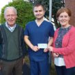 Vincent Lennon and daughter Fiona McKenna presenting a cheque to Dr Sherry of the Acute Care at Home Service.