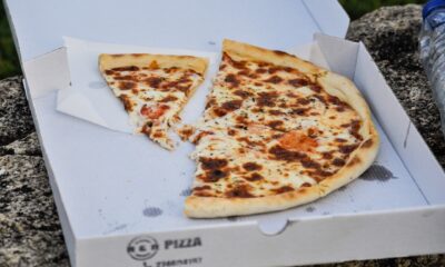 half eaten pizza in a pizza box