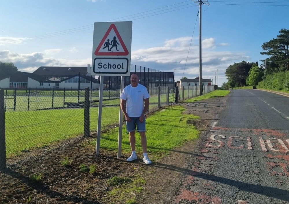 Councillor Keith Ratcliffe outside Markethill High School