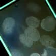 Mobil phone with finger prints visible on the screen
